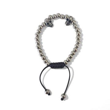 Brazalete de balines y calaveras